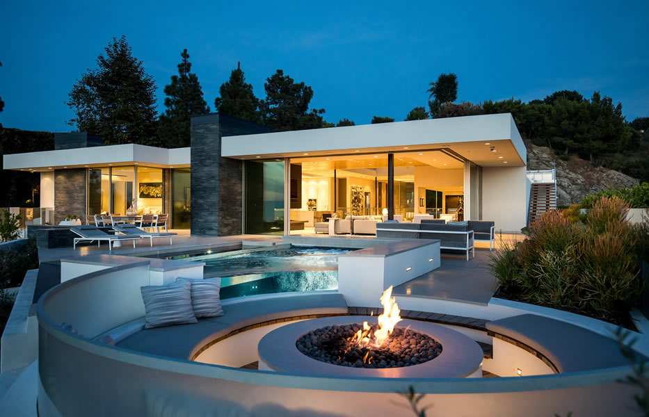 Luxury custom home in Arizona with outdoor fire pit, pool, and modern architecture