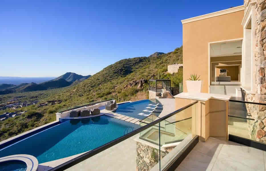 Infinity pool with mountain views by a custom home builder in Phoenix, AZ