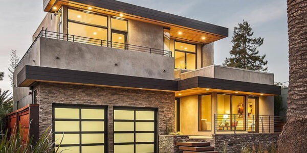 Team of new home builders in Scottsdale Arizona reviewing floor plans on construction site